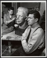 Evelyn Raymond sculpting a bust of Frederick Manfred, ca. 1945